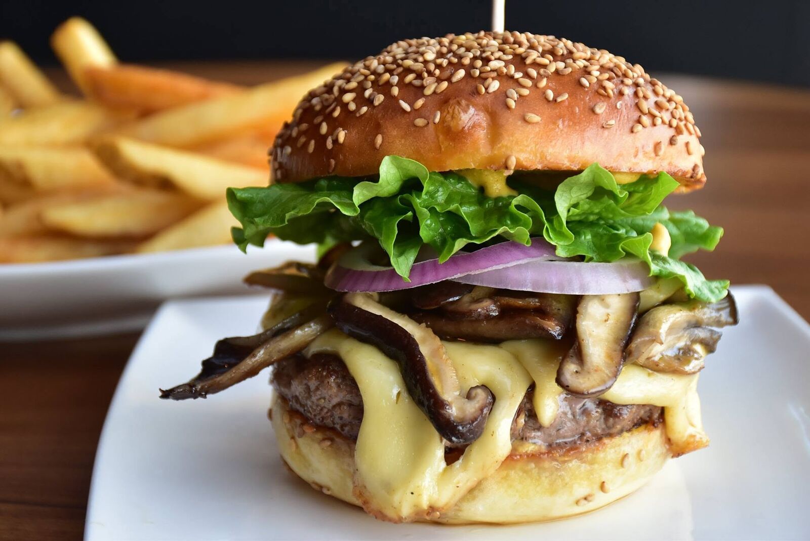 Mushroom Swiss burger and fries at WinK